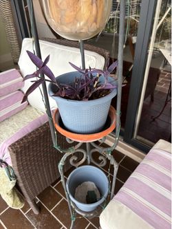 Wrought iron stand with cand le