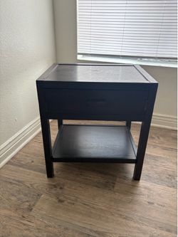 Dark brown wooden night stand with drawer