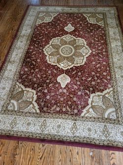 Two large area rugs for dining room and living room