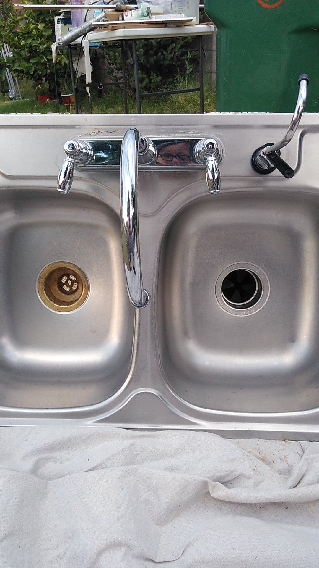 Stainless steel kitchen sink 33" w by 20 1/2 L w. Garage disposal almost new