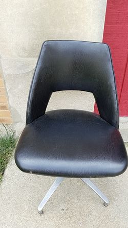 MCM black studded vinyl swivel chair