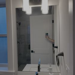 Vanity Light Fixture And Frameless Mirror