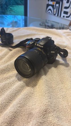 Nikon D3200 with lenses battery charger and strap
