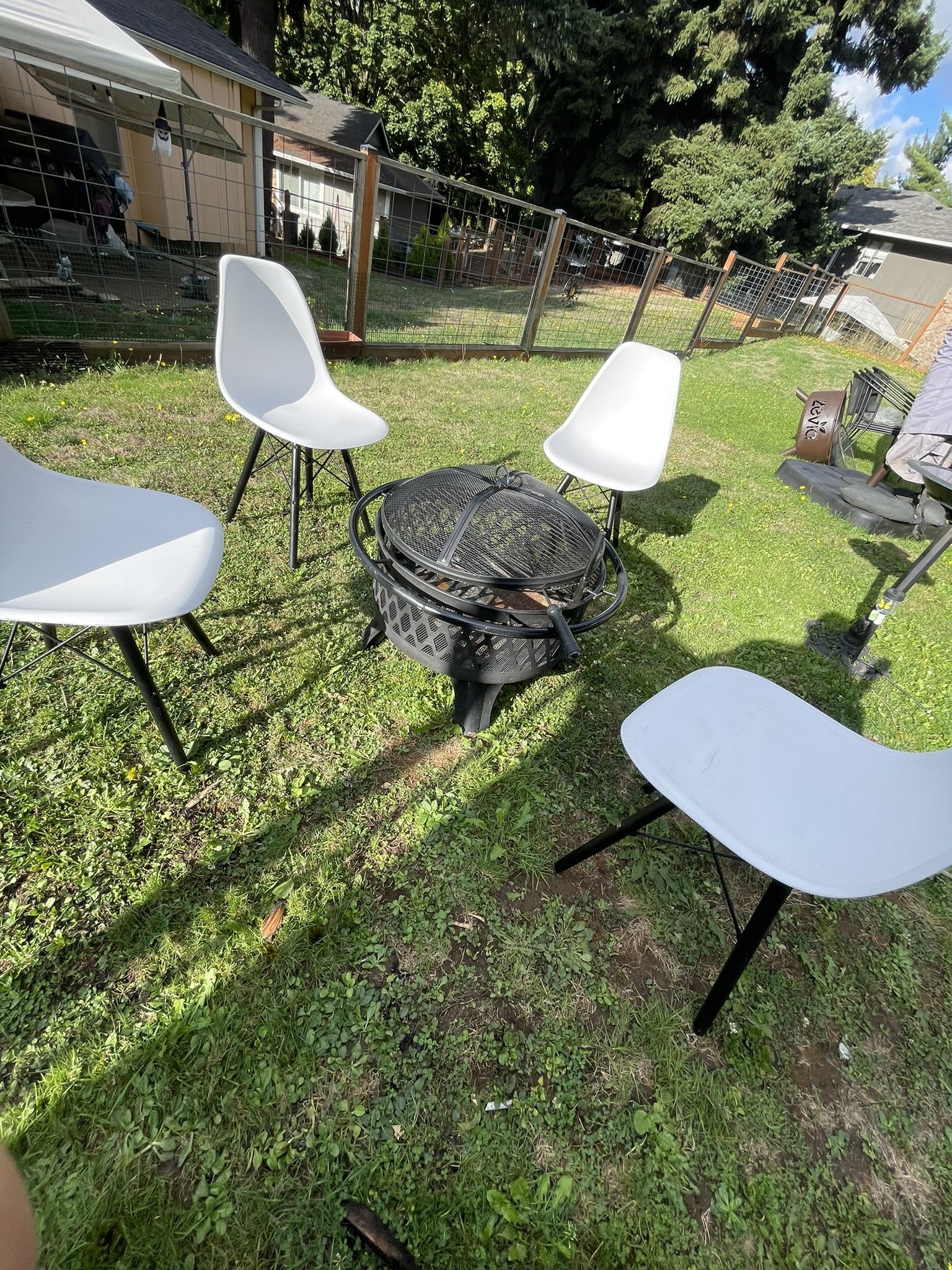 Wood-burning fire pit, four chairs included, all in good condition.