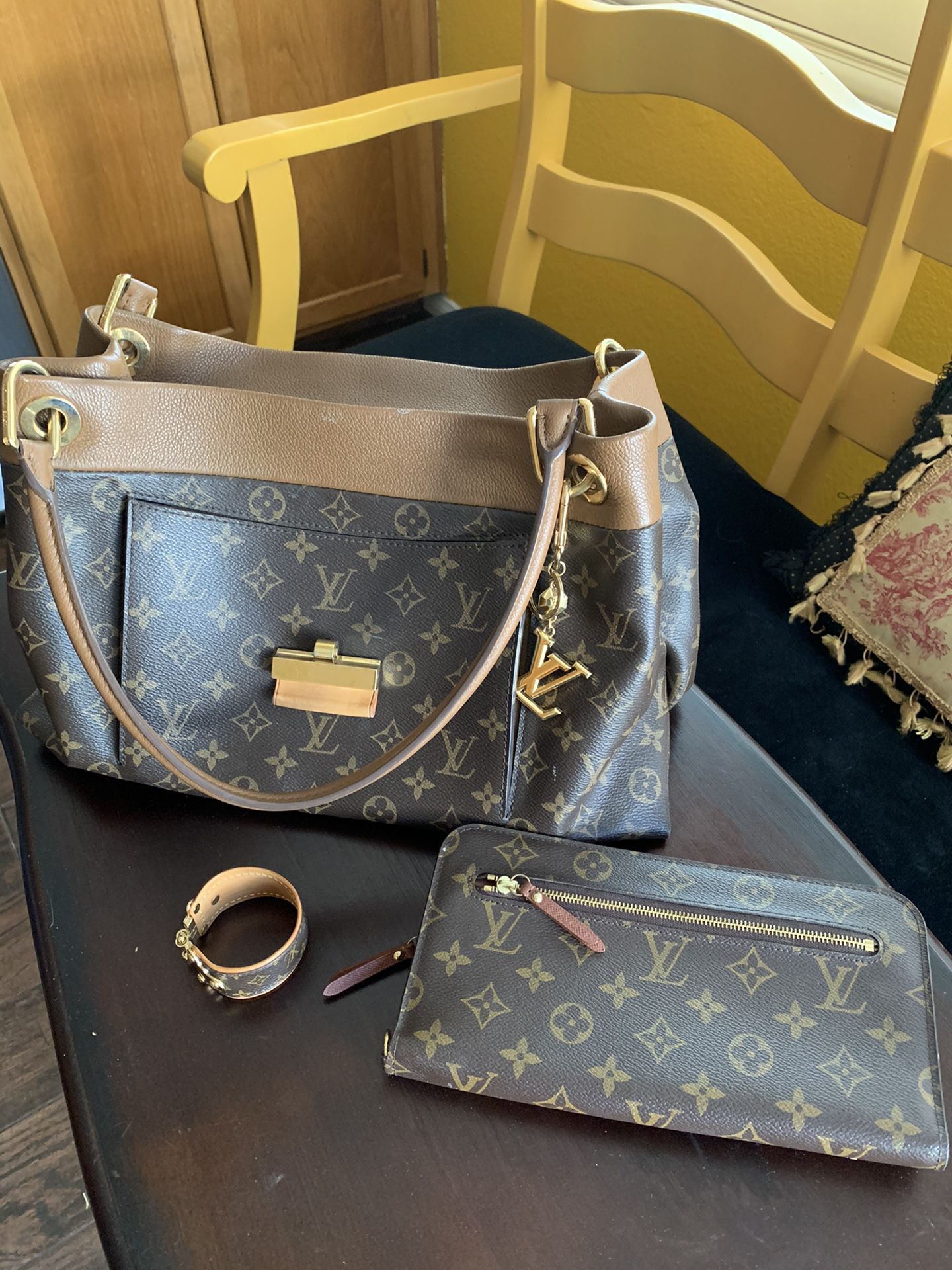 Louis Vuitton Olympe bag, new wallet, keychain & cuff. Purse has been used twice along with the other items except wallet. Cost over $5000.