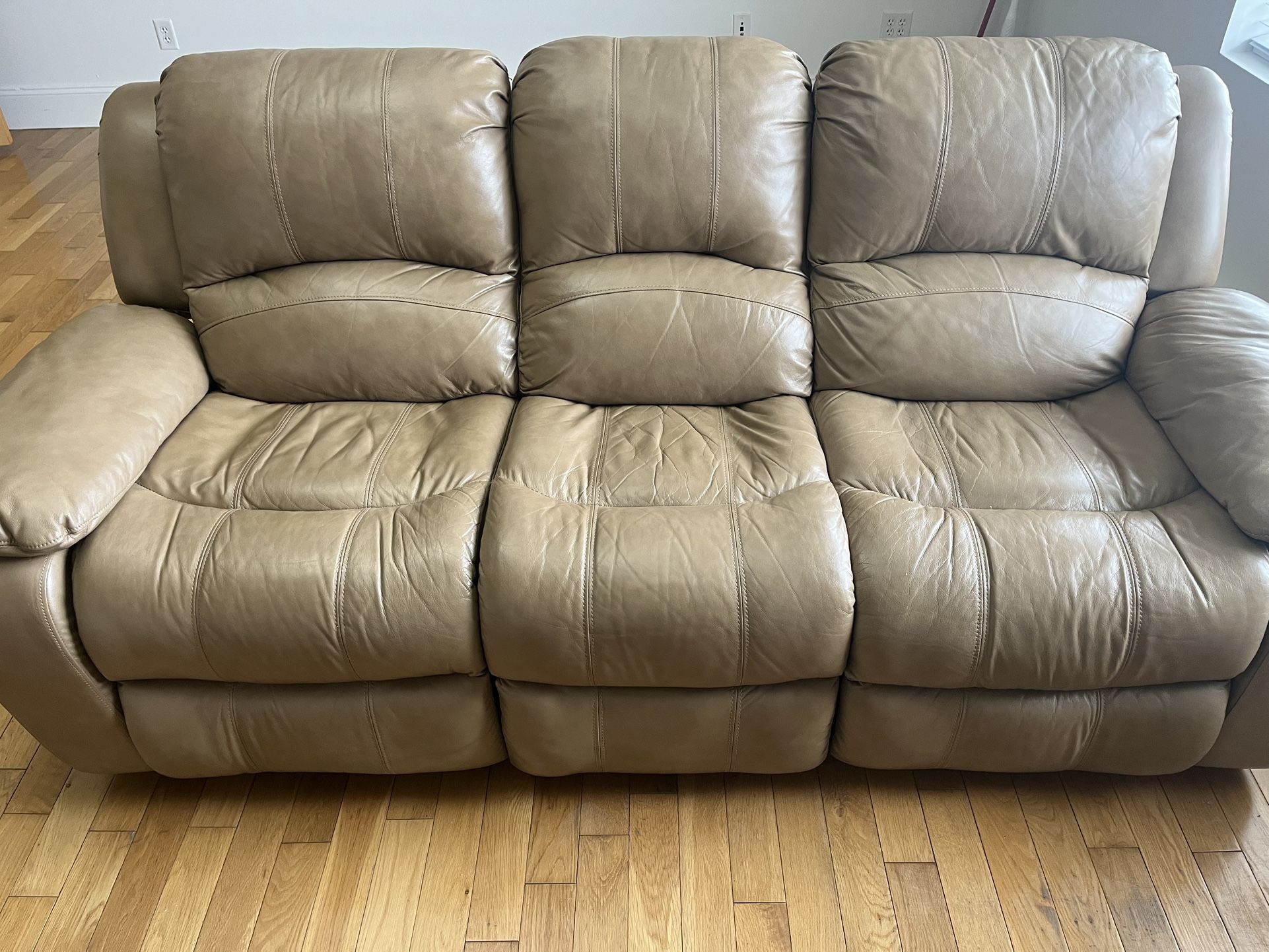 Leather power reclining sofa