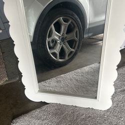Beautiful white trim, scalloped mirror