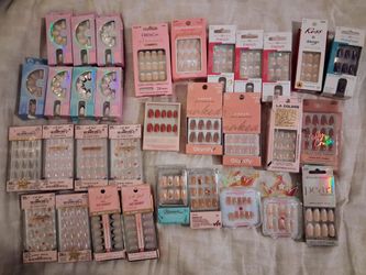 32 various packs of glue-on and press-on fake nails