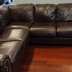 Ashley Genuine Leather Sectional And Chair Ottoman 