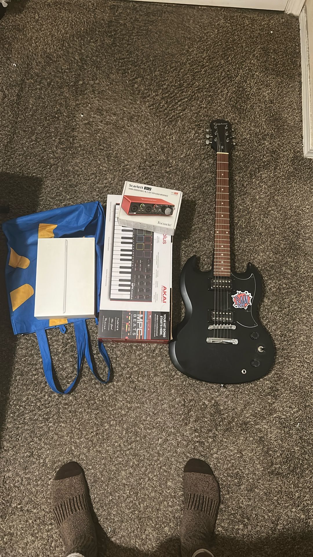 Epiphone SG Electric Guitar, MPK Mini Keyboard Plus, Audio Interface(Focusrite Scarlett 2i2), iPad 9th Generation.