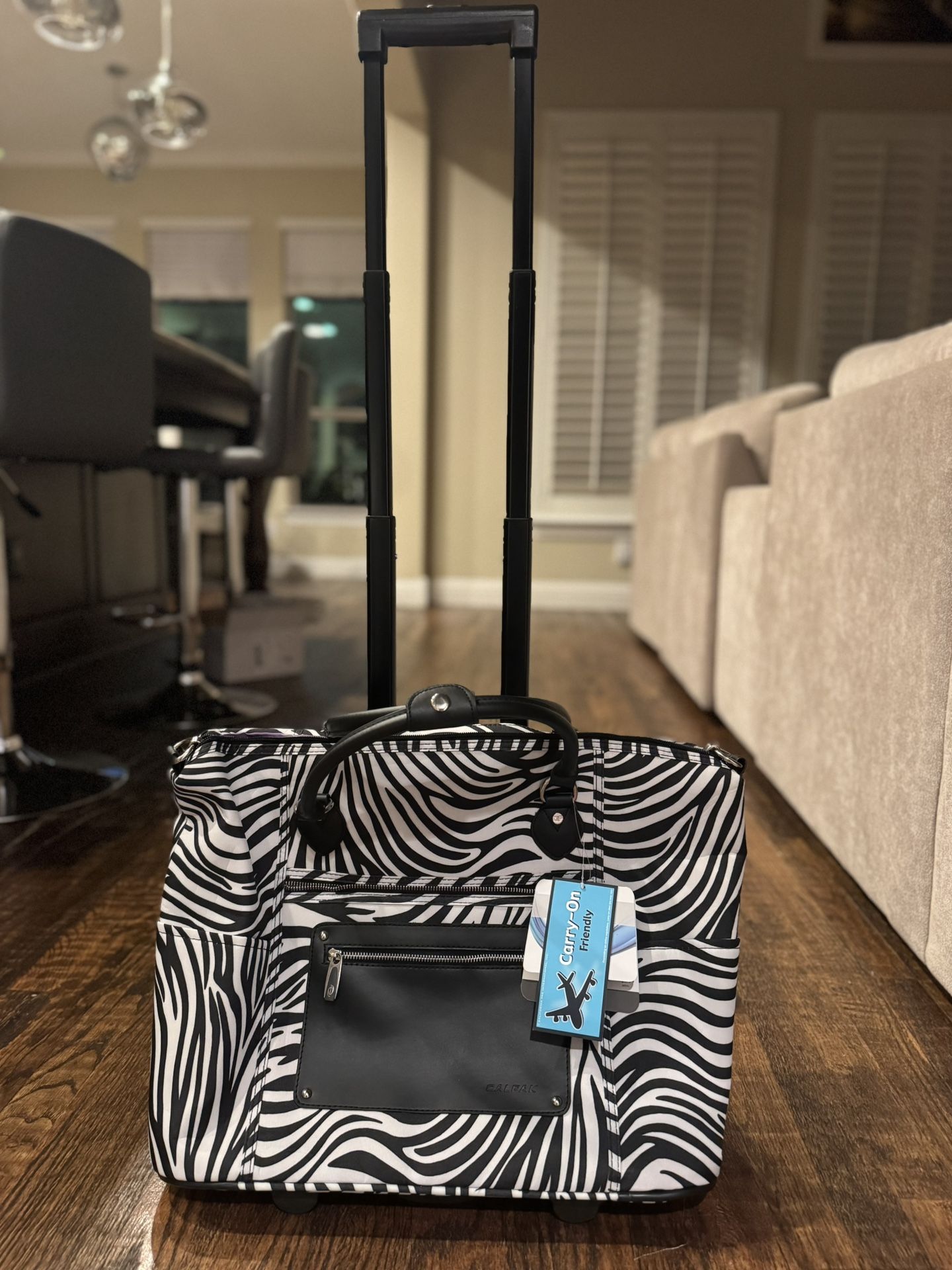 CalPak -  Zebra Print Duffel Laptop Rolling Carry on