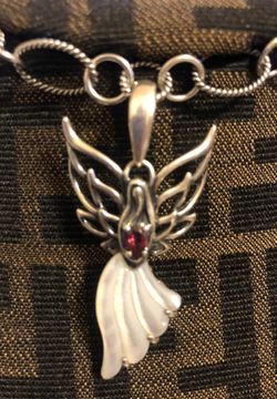 Charms mother of pearl & Garnet Angel sterling silver.925, from Carolyn Pollack 2 x 1 1/2 inch. Serious buyers only.