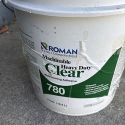 Heavy duty clear wallcovering adhesive