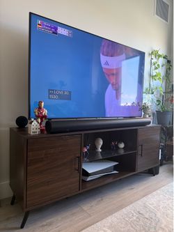 Brown TV stand with glass shelf