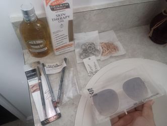 Cosmetics, Body Oils, And Sun Glasses