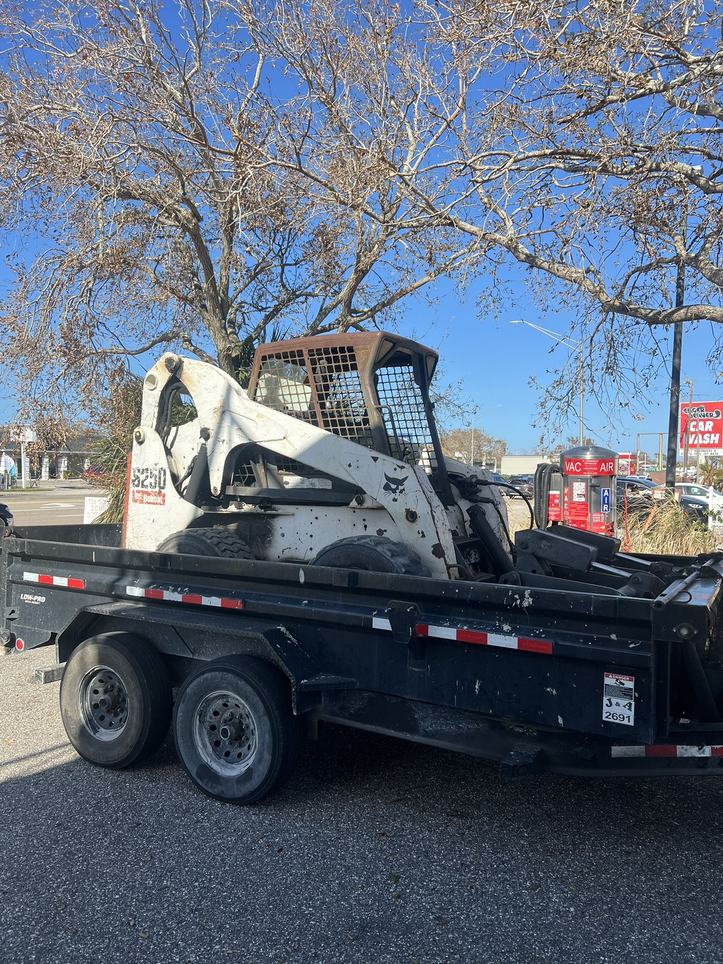 Dump Trailer And Bobcat