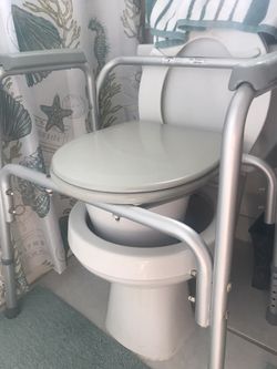 Adjustable commode for toilet also can be used in the shower for seat has lower bucket for no splash