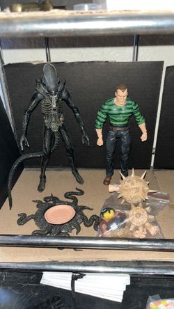 Sandman and alien action figures