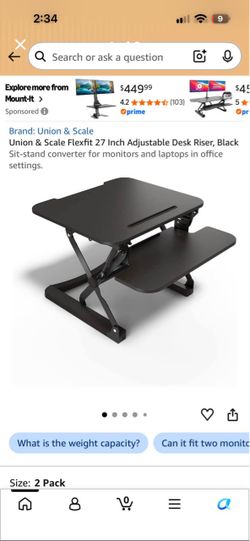 Adjustable Desk Riser, Black Sit-stand converter for monitors and laptops in office settings.