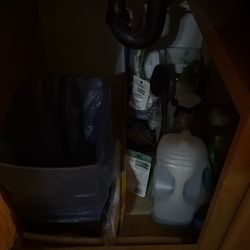 Cleaning Supplies And Trashcan