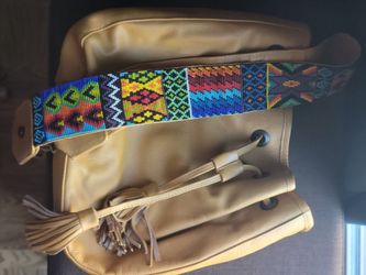 leather crossbody with handbeaded strap
