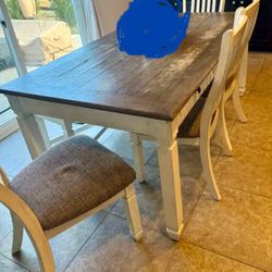 Dining Table with 6 Drawers & 4 Cushioned Chairs 