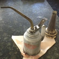 Antique Oil Can And An Oil Spout
