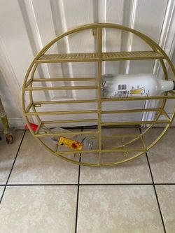 wall-mounted round wine rack and glass holder.