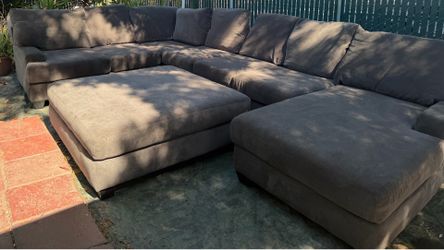 Grey sectional with huge ottoman good condition clean we sell all the time delivery $40 local