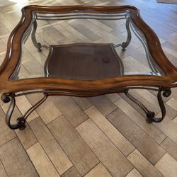 Wood Framed Glass Table With Metal Decorative Legs