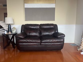 Brown leather loveseat