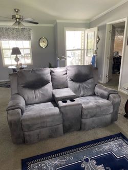 Reclining love seat with USB  charging port used