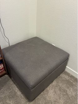Gray Ottomon with storage compartment