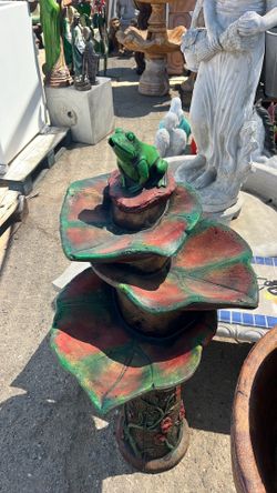 Concrete fountain with frog