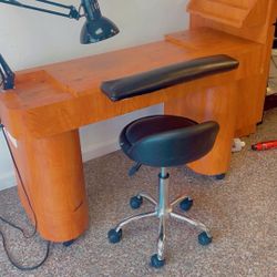 A well-maintained manicure table in great condition.