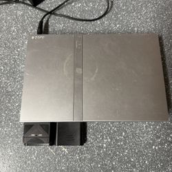 PlayStation 2 Slim With Games And 2 Wireless Controllers