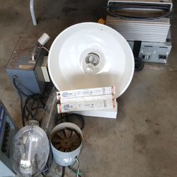 2 Grow lights,with 1000 watt bulbs, ballasts and 6”vented hoods, also this round Hooded Halide light with ballast.