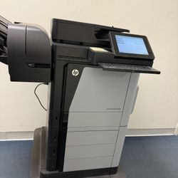 HP Color LaserJet Enterprise MFP M680 multifunction printer designed for high-volume printing in a business or office setting. It is capable