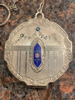 1927 enamalled compact with original puffs and powder/ engraved 1927 beautiful Victorian piece