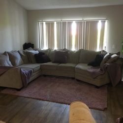 Grey Sectional Lavender Rug And Pillows 