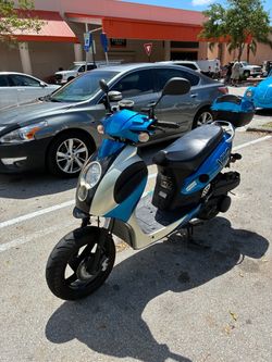 Blue and White Gas Moped Scooter