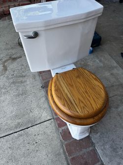 Vintage low style toilet with high volume flush.