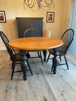 Round table and three chairs