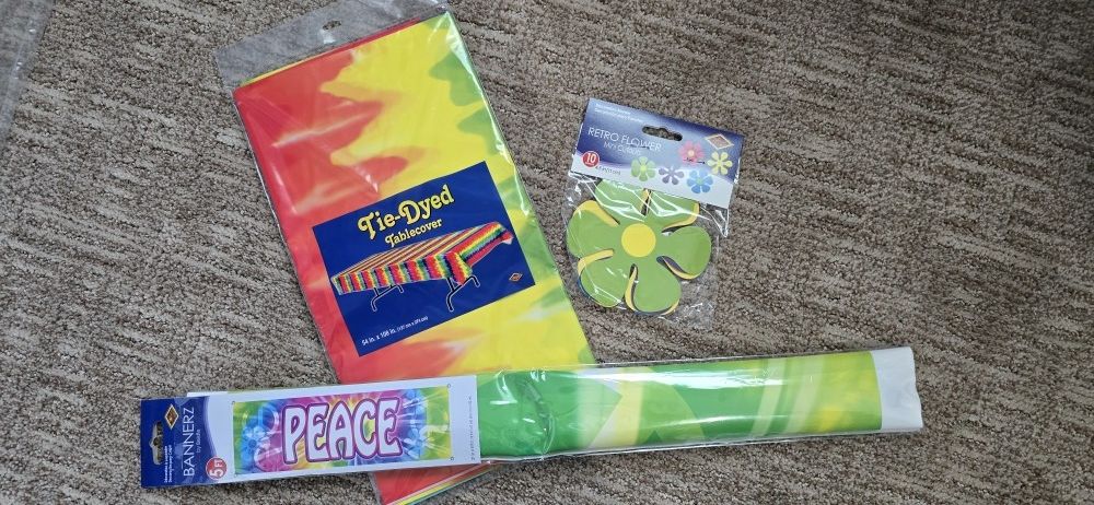 Tie dye hippie party supplies 1960s Theme table cover, peace banner, retro flower mini cutouts.