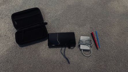 Modded 3Ds with charger, case, and four stylus