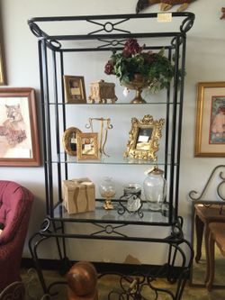 Metal stand with three glass shelves