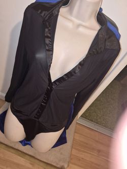 Black slightly sheer long sleeve professional snappy crotch shirt.