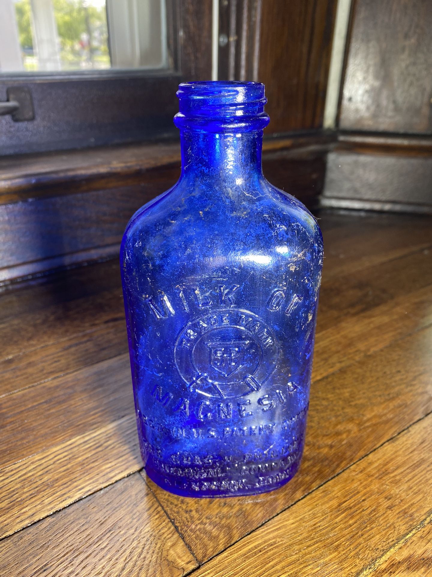 Vintage cobalt blue milk of magnesia bottle