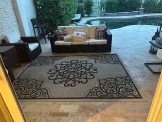 Black rattan sofa and 2 chairs