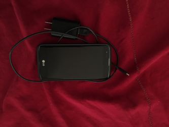 LG cell phone with charger, case and holder